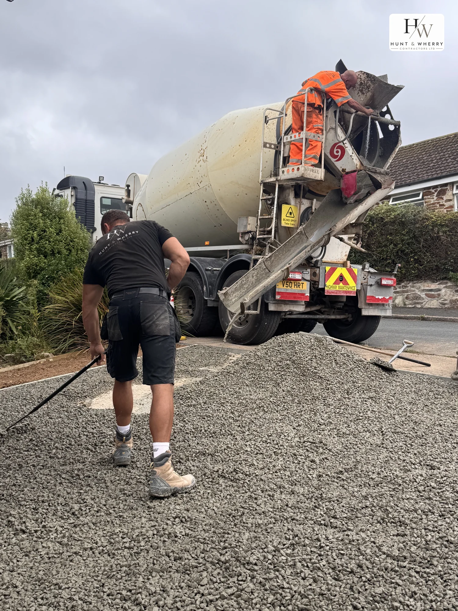 HW Contractors pouring ready-mix concrete on site