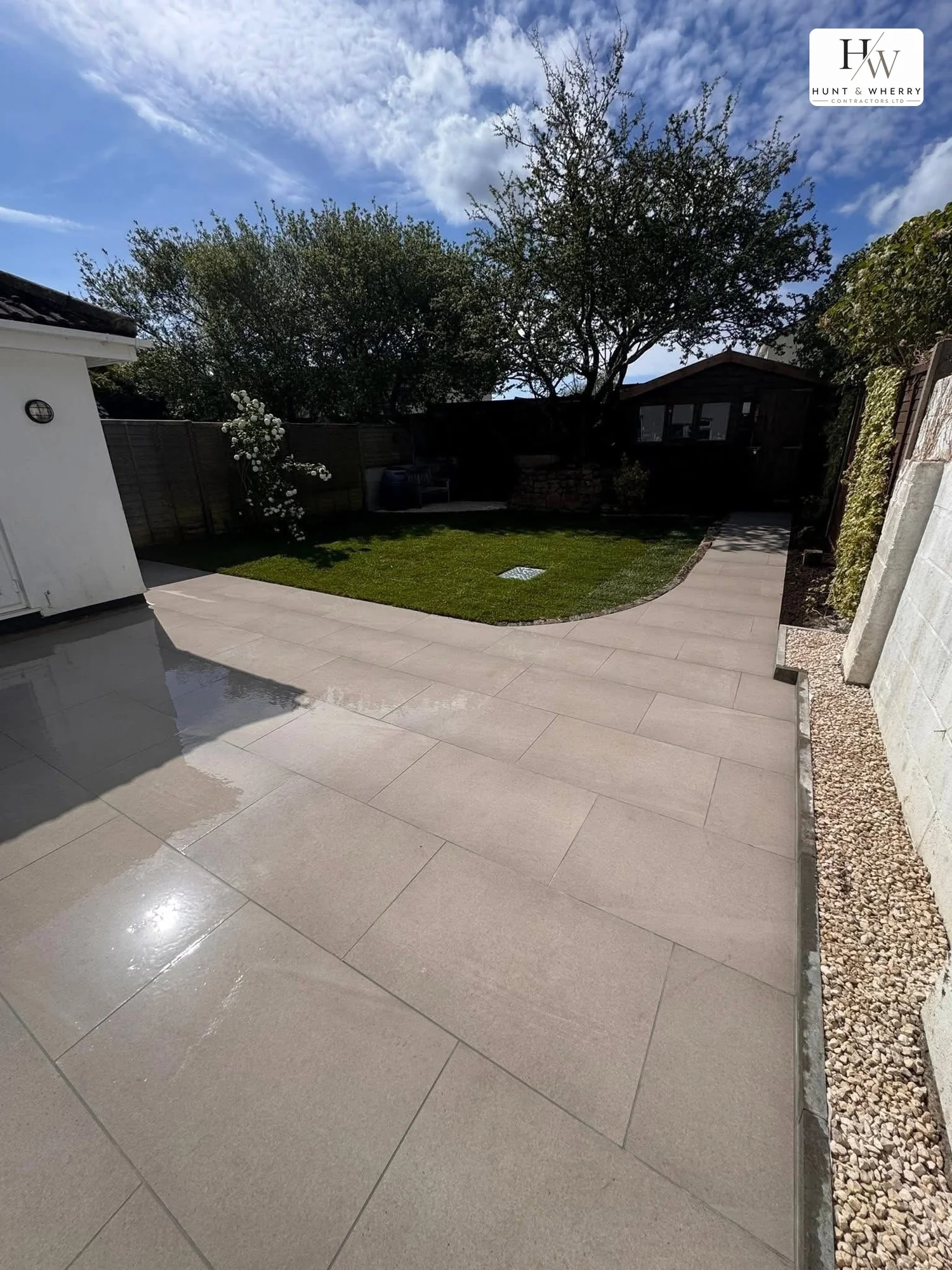 Wraparound porcelain patio and path at a bungalow