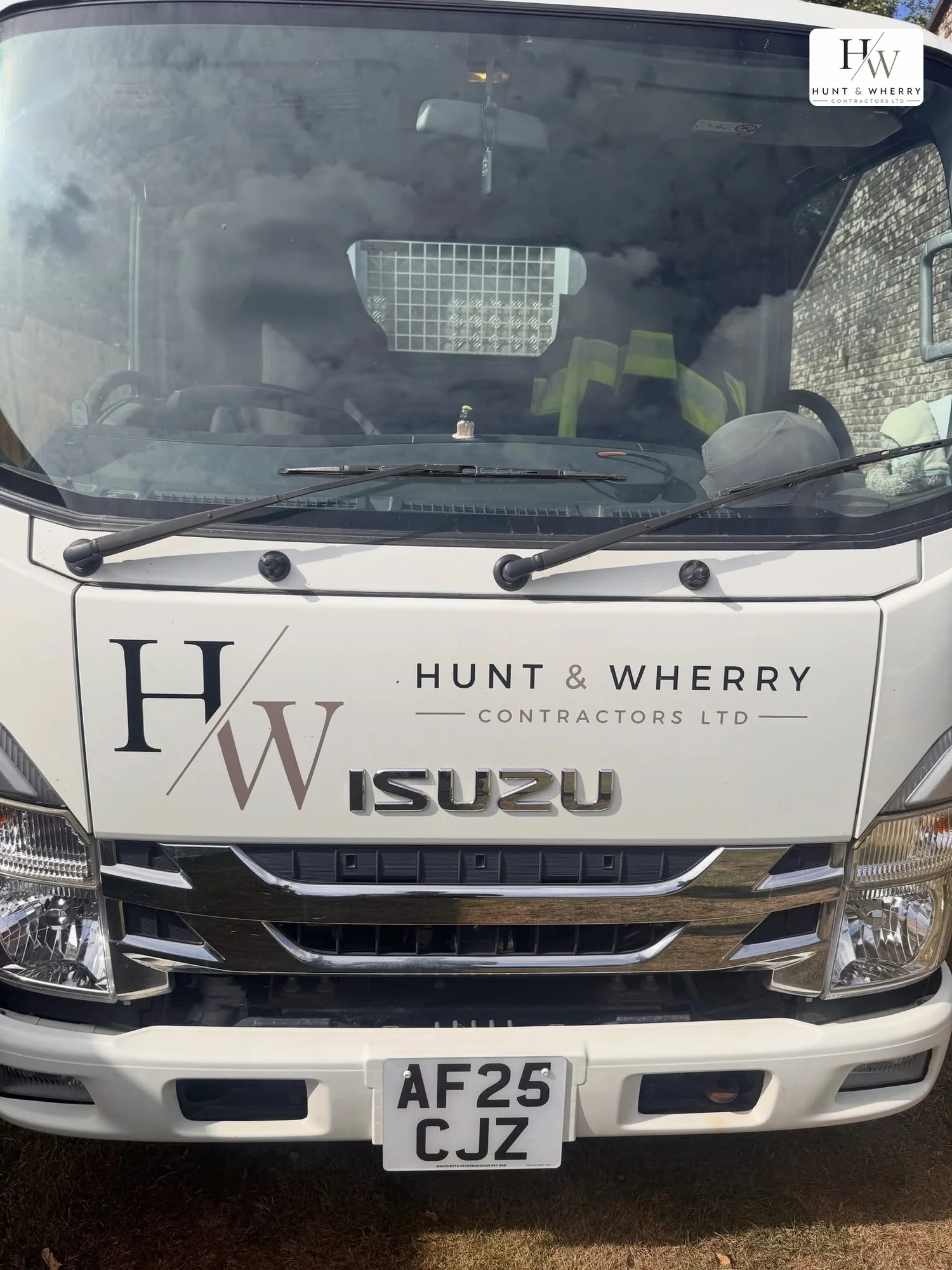 Front of the HW Contractors Isuzu tipper with Hunt and Wherry logo